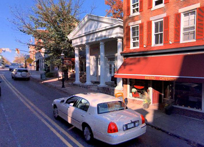 3/4 view of building facade 21 N Main from street level - proceeding north on N Main